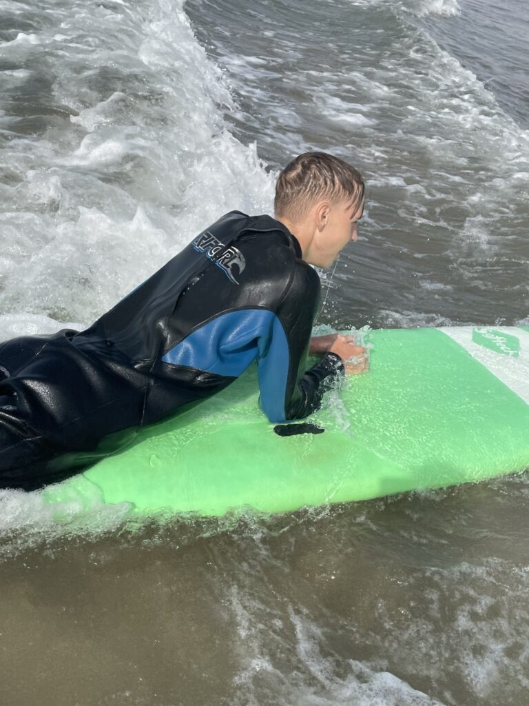 Brandt laying on his board