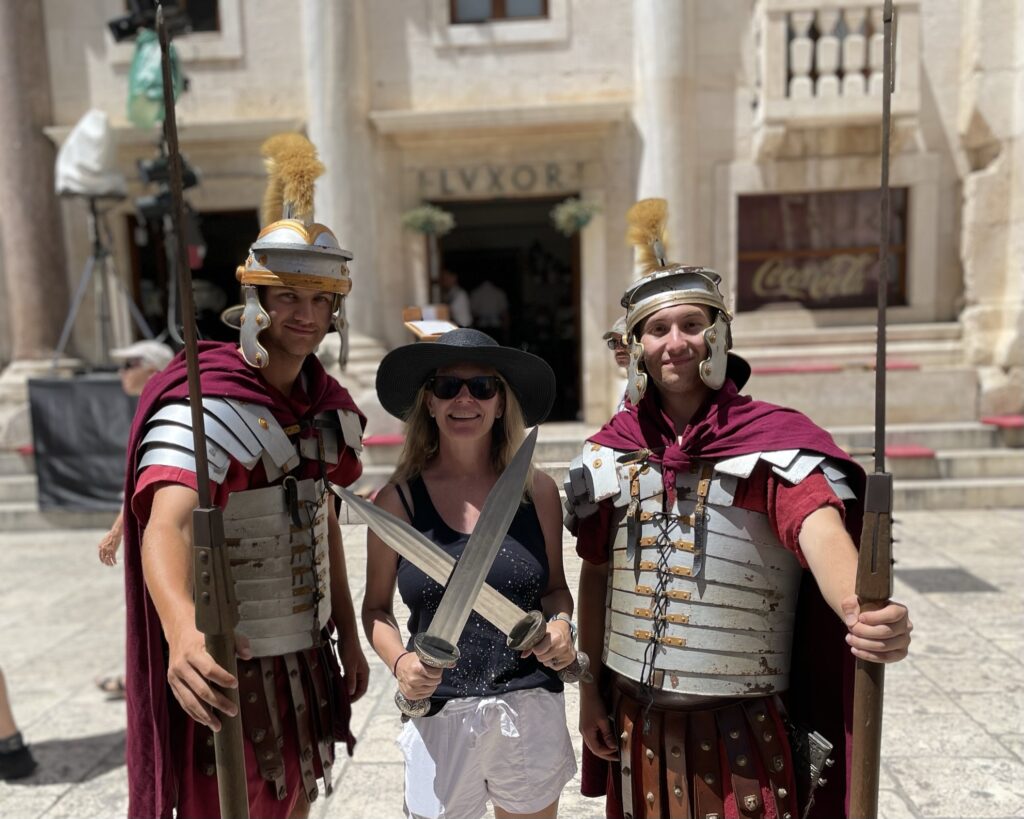 Roman soldiers with lady holding swords